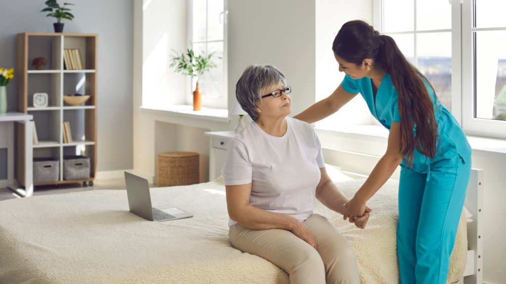 A health assistant helping an old lady